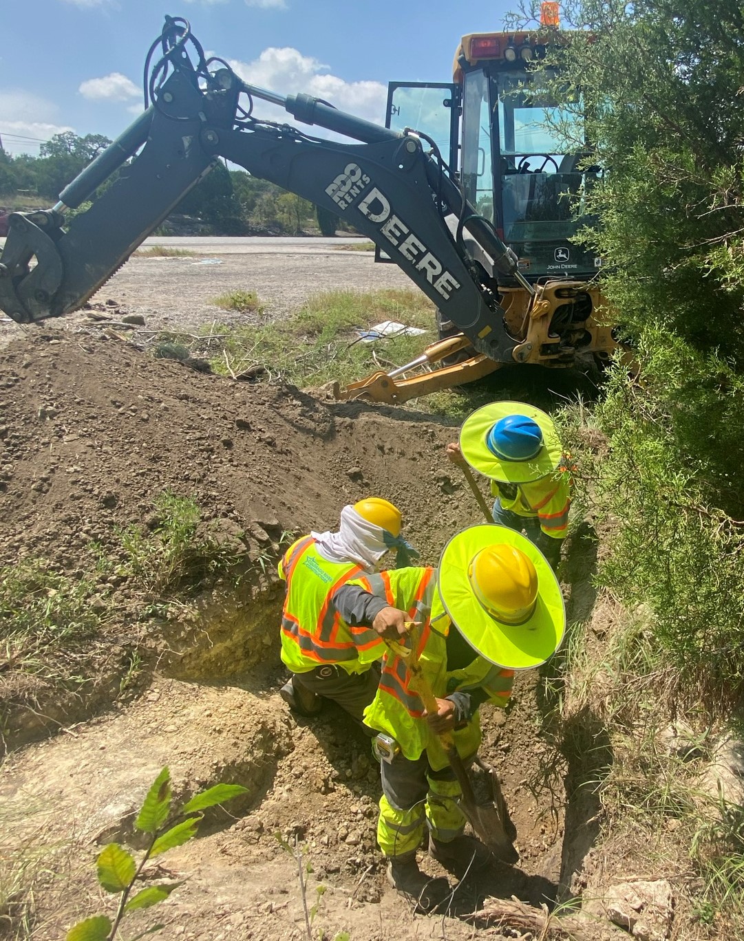 Crews dig near US 290 and Hudson Loop to find an existing 12-inch waterline. Determining depths of existing lines before construction will help engineers properly plan for upcoming utility relocations connected to the project. September 2021